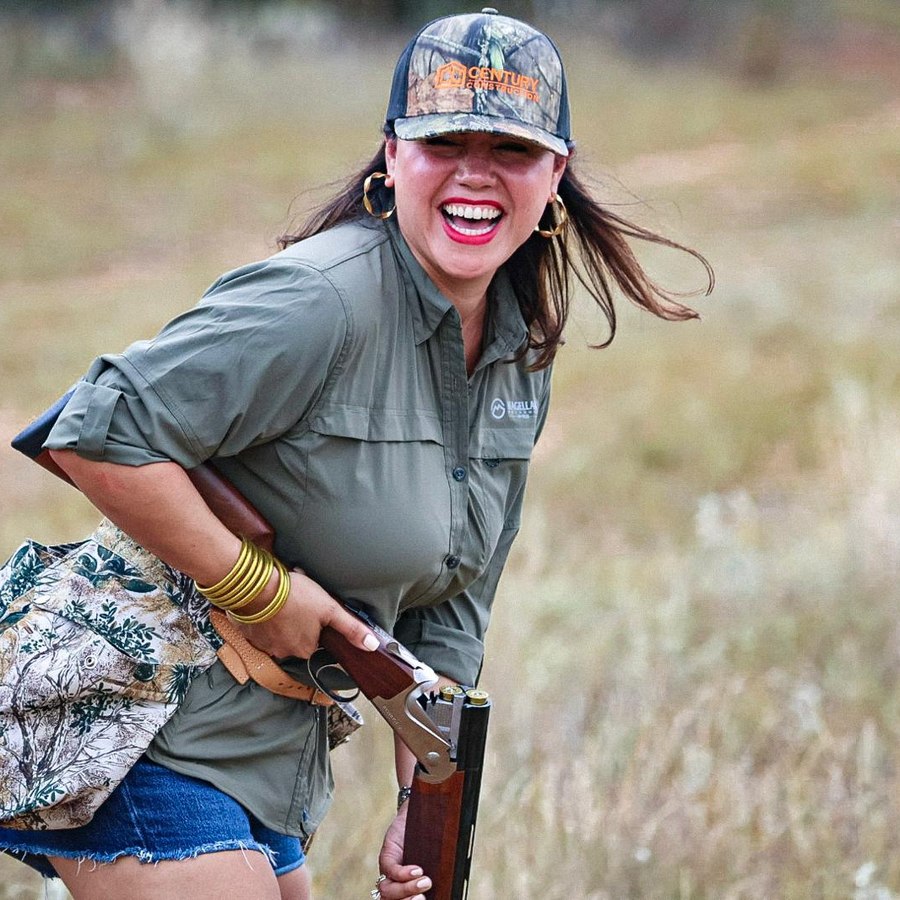 Jessica laughing in the field on a South Texas dove hunt